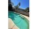 Inviting pool with sunbathing area, perfect for cooling off and enjoying outdoor leisure activities at 9617 Pine River Ln, Las Vegas, NV 89123
