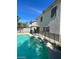 In-ground freeform swimming pool with -safety fence at 9617 Pine River Ln, Las Vegas, NV 89123
