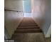 Carpeted staircase leading up to the next level at 9617 Pine River Ln, Las Vegas, NV 89123