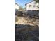 View of backyard with rocks and block wall around property at 9801 Bradford Summit St, Las Vegas, NV 89183