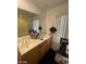 This bathroom has double sinks, cabinets and a shower/bathtub area at 9801 Bradford Summit St, Las Vegas, NV 89183