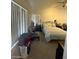 Spacious bedroom with a vaulted ceiling, natural light, comfortable seating, and decorative accents at 9801 Bradford Summit St, Las Vegas, NV 89183