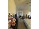 Bedroom area with a vaulted ceiling, carpeted floors, and a dresser at 9801 Bradford Summit St, Las Vegas, NV 89183