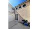 Garage door of home highlighting a well-kept exterior and attached garage, adjacent to a paved driveway on a sunny day at 9801 Bradford Summit St, Las Vegas, NV 89183