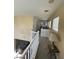 Upstairs hallway that offers a view down into the lower floor and a glimpse of the rooms at 9801 Bradford Summit St, Las Vegas, NV 89183