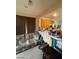 Cozy living space featuring a comfortable sofa and an open view of the kitchen area at 9801 Bradford Summit St, Las Vegas, NV 89183