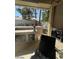 Outdoor kitchen area with built-in barbecue and adjacent dining area at 9801 Bradford Summit St, Las Vegas, NV 89183