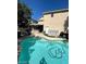 Beautiful backyard pool area with patio, grill, and outdoor seating at 9801 Bradford Summit St, Las Vegas, NV 89183