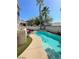 Inviting backyard pool with lush landscaping, lounge chairs and spa at 9801 Bradford Summit St, Las Vegas, NV 89183