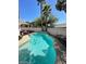 Sparkling blue swimming pool nestled among palm trees, perfect for cooling off at 9801 Bradford Summit St, Las Vegas, NV 89183