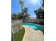 Backyard swimming pool view from deck with palm trees at 9801 Bradford Summit St, Las Vegas, NV 89183