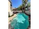 Desert home with a gorgeous backyard swimming pool and lounge area at 9801 Bradford Summit St, Las Vegas, NV 89183