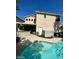This backyard features a pool with a concrete patio and block wall at 9801 Bradford Summit St, Las Vegas, NV 89183