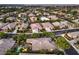 Aerial view of the neighborhood, highlighting the homes, pool, and landscaping at 10300 Wellside Hill Ave, Las Vegas, NV 89145