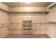 Walk-in closet with built in shelving and lighting at 10300 Wellside Hill Ave, Las Vegas, NV 89145