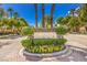 Elegant Scarlett Canyon community entrance with stone signage and manicured landscaping at 10300 Wellside Hill Ave, Las Vegas, NV 89145