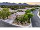 Aerial view of the home showing the roof, landscaping, and mountain view at 10300 Wellside Hill Ave, Las Vegas, NV 89145