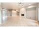 Bright living room features a fireplace and tile flooring at 10300 Wellside Hill Ave, Las Vegas, NV 89145