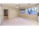 Bright living room features tree views from its large window at 10300 Wellside Hill Ave, Las Vegas, NV 89145