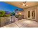 Charming outdoor patio with view of landscaped backyard and secure pool fence at 10300 Wellside Hill Ave, Las Vegas, NV 89145