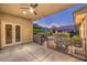 Outdoor patio area with lush landscaping and secure pool fencing at 10300 Wellside Hill Ave, Las Vegas, NV 89145
