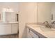 Bathroom featuring dual sinks, white cabinets, quartz counters, and modern fixtures at 105 Barkset Way, Henderson, NV 89011