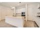 Well-lit kitchen with white cabinets, a stylish island, and stainless steel appliances at 105 Barkset Way, Henderson, NV 89011