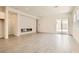 Spacious living room featuring tile floors, recessed lighting, and sliding glass doors at 105 Barkset Way, Henderson, NV 89011