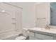 A bright bathroom has a single vanity, a large mirror, and a shower over bath at 107 Barkset Way, Henderson, NV 89011