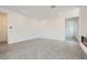 An open living room features hard flooring, recessed lighting, and a modern fireplace at 107 Barkset Way, Henderson, NV 89011