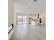 A spacious living room boasts tile flooring, recessed lighting, and sliding doors leading to the outdoor patio at 107 Barkset Way, Henderson, NV 89011