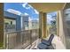 Outdoor balcony features neutral toned outdoor seating and a metal safety railing at 11289 Vision Peak Ave # 103, Las Vegas, NV 89135