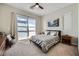 Bedroom with a comfortable bed, dresser, closet and a sliding glass door to the outside at 11289 Vision Peak Ave # 103, Las Vegas, NV 89135