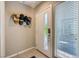 Clean and bright entryway featuring modern door with glass and adjacent window at 11289 Vision Peak Ave # 103, Las Vegas, NV 89135