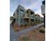 Modern two-story townhome featuring private balconies and contemporary architectural details at 11289 Vision Peak Ave # 103, Las Vegas, NV 89135