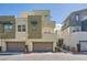 Stylish townhome with a modern exterior and a private garage, offering convenient and upscale living at 11289 Vision Peak Ave # 103, Las Vegas, NV 89135
