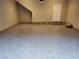 Spacious garage features sealed concrete floors and interior door for easy access to the main house at 11289 Vision Peak Ave # 103, Las Vegas, NV 89135