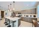 Modern kitchen features a large island with bar seating and stainless steel appliances at 11289 Vision Peak Ave # 103, Las Vegas, NV 89135
