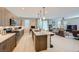 Open-concept kitchen with island flows seamlessly into the living area at 11289 Vision Peak Ave # 103, Las Vegas, NV 89135