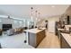 Modern kitchen with island connecting to the living space for open-concept living at 11289 Vision Peak Ave # 103, Las Vegas, NV 89135