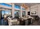 Stunning lobby features high ceilings, designer lighting, modern furniture, and a cozy fireplace at 11289 Vision Peak Ave # 103, Las Vegas, NV 89135