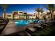 Inviting community pool area with lounge chairs and meticulously maintained landscaping for residents' enjoyment at 11289 Vision Peak Ave # 103, Las Vegas, NV 89135