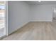 Bright bedroom with new flooring and a sliding glass door at 1225 Arrowhead Ave, Las Vegas, NV 89106