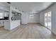 Open concept living area with view into the kitchen and sliding door access to the backyard at 1225 Arrowhead Ave, Las Vegas, NV 89106