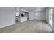 Spacious living room featuring an open layout to the kitchen and sliding doors at 1225 Arrowhead Ave, Las Vegas, NV 89106