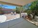Backyard patio with chairs and water feature, providing a peaceful spot for relaxing in nature at 13 Desert Dawn Ln, Henderson, NV 89074