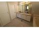 Bright bathroom with granite countertops, dual sinks, and modern fixtures at 13 Desert Dawn Ln, Henderson, NV 89074
