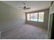 Bedroom with ceiling fan, wood floors, and a view of the pool at 13 Desert Dawn Ln, Henderson, NV 89074