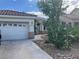 Charming single story home with desert landscaping and attached garage at 13 Desert Dawn Ln, Henderson, NV 89074