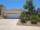Charming single-story home featuring a two-car garage and xeriscaped front yard at 13 Desert Dawn Ln, Henderson, NV 89074